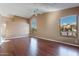 Living room with hardwood floors and large windows, showcasing natural light and views at 6403 S Fairway Dr, Gold Canyon, AZ 85118