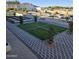 Modern courtyard with geometric pavers, artificial turf, and a water feature at 6587 N Palmeraie Blvd # 2010, Paradise Valley, AZ 85253