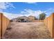 Large backyard with a patio and space for outdoor entertaining at 670 E Wiley Way, Casa Grande, AZ 85122