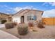 Charming one-story home with drought-tolerant landscaping at 670 E Wiley Way, Casa Grande, AZ 85122