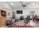 Open living room with dining area and hardwood floors at 670 E Wiley Way, Casa Grande, AZ 85122