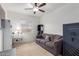 Home office with a sofa, built-in shelving and ceiling fan at 670 E Wiley Way, Casa Grande, AZ 85122