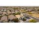 Wide aerial view of a house and surrounding neighborhood, showing street and other homes at 7225 W Jones Ave, Phoenix, AZ 85043