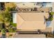 House's roofline and backyard, featuring a small grassy area at 7225 W Jones Ave, Phoenix, AZ 85043