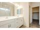 Double vanity bathroom with white cabinets and tiled flooring at 7225 W Jones Ave, Phoenix, AZ 85043