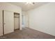 Simple bedroom with closet and carpet flooring at 7225 W Jones Ave, Phoenix, AZ 85043