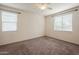 Bedroom with two windows and carpet flooring at 7225 W Jones Ave, Phoenix, AZ 85043