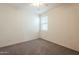 Empty bedroom with carpet flooring and window at 7225 W Jones Ave, Phoenix, AZ 85043