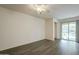 Living room with wood-look flooring and sliding glass door at 7225 W Jones Ave, Phoenix, AZ 85043