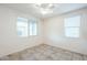 Bright spare bedroom with tile flooring and window blinds at 7225 W Jones Ave, Phoenix, AZ 85043