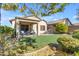 Artificial turf backyard with covered patio and seating at 7325 W Pleasant Oak Way, Florence, AZ 85132