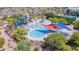 Aerial view of community pool with water slides and play area at 7325 W Pleasant Oak Way, Florence, AZ 85132