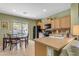 Kitchen features light wood cabinets and a breakfast nook at 7325 W Pleasant Oak Way, Florence, AZ 85132