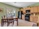 Kitchen features light wood cabinets and a breakfast nook at 7325 W Pleasant Oak Way, Florence, AZ 85132