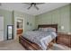 Main bedroom with en-suite bathroom access and ceiling fan at 7325 W Pleasant Oak Way, Florence, AZ 85132