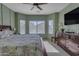 Main bedroom with dresser, large windows, and ceiling fan at 7325 W Pleasant Oak Way, Florence, AZ 85132