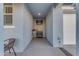 Light and airy entryway with dark front door and tile flooring at 7332 S Briarwood Ln, Gilbert, AZ 85298