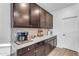 Kitchen with dark brown cabinets and coffee bar area at 7332 S Briarwood Ln, Gilbert, AZ 85298