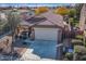 Single story home with a two-car garage and a side yard at 741 W Harvest Rd, San Tan Valley, AZ 85140