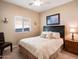 Bright bedroom with ceiling fan and window at 741 W Harvest Rd, San Tan Valley, AZ 85140