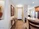 Bright entryway with tile flooring, a console table, and access to the kitchen at 741 W Harvest Rd, San Tan Valley, AZ 85140