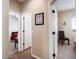 Bright hallway with tile flooring, leading to bedrooms at 741 W Harvest Rd, San Tan Valley, AZ 85140