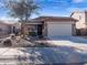 One-story house with attached garage and landscaping at 741 W Harvest Rd, San Tan Valley, AZ 85140