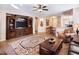 Living room with an entertainment center and comfortable seating at 741 W Harvest Rd, San Tan Valley, AZ 85140