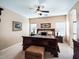 Spacious main bedroom with dark wood furniture and carpeted floors at 741 W Harvest Rd, San Tan Valley, AZ 85140