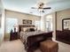 Spacious main bedroom with dark wood furniture and carpeted floors at 741 W Harvest Rd, San Tan Valley, AZ 85140