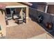 Covered patio with comfortable seating and a built-in grill at 741 W Harvest Rd, San Tan Valley, AZ 85140