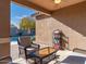 Covered patio with wicker furniture and pool view at 741 W Harvest Rd, San Tan Valley, AZ 85140