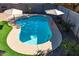 Stunning kidney-shaped pool with surrounding landscaping at 741 W Harvest Rd, San Tan Valley, AZ 85140