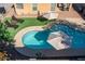 Aerial view of a refreshing kidney-shaped pool in a backyard oasis at 741 W Harvest Rd, San Tan Valley, AZ 85140