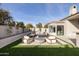 Modern patio furniture around a fire pit in a grassy backyard at 7705 E Doubletree Ranch Rd # 39, Scottsdale, AZ 85258