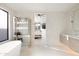 Bathroom with a freestanding tub, glass shower, and bedroom view at 7705 E Doubletree Ranch Rd # 39, Scottsdale, AZ 85258