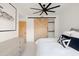 Bright bedroom with wood accent wall and ceiling fan at 7705 E Doubletree Ranch Rd # 39, Scottsdale, AZ 85258