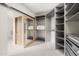 Large walk-in closet with ample shelving and hanging space at 7705 E Doubletree Ranch Rd # 39, Scottsdale, AZ 85258