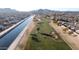 Aerial view showing community near golf course and canal at 8687 E Tuckey Ln, Scottsdale, AZ 85250