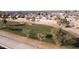 Aerial view of homes adjacent to a golf course at 8687 E Tuckey Ln, Scottsdale, AZ 85250