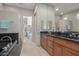 Elegant bathroom with double vanity and large walk-in shower at 8687 E Tuckey Ln, Scottsdale, AZ 85250