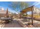 Outdoor patio with dining and seating areas at 8687 E Tuckey Ln, Scottsdale, AZ 85250