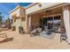 Covered patio with seating area and flagstone flooring at 8687 E Tuckey Ln, Scottsdale, AZ 85250