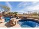 Relaxing pool and spa with large boulders at 8687 E Tuckey Ln, Scottsdale, AZ 85250