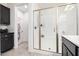 Bathroom with shower stall, vanity, and dark brown cabinets at 880 E Verde Blvd, Queen Creek, AZ 85140