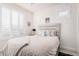 Bright bedroom with white shutters and a comfy bed at 880 E Verde Blvd, Queen Creek, AZ 85140