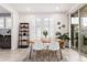 Elegant dining area with a wooden table and white chairs at 880 E Verde Blvd, Queen Creek, AZ 85140