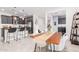 Kitchen and dining area with wooden table and modern chairs at 880 E Verde Blvd, Queen Creek, AZ 85140