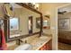 Primary bathroom with dual sinks, granite countertop, and large mirror at 8947 E Mescal St, Scottsdale, AZ 85260