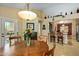 Dining area with a round wooden table and access to the kitchen at 8947 E Mescal St, Scottsdale, AZ 85260